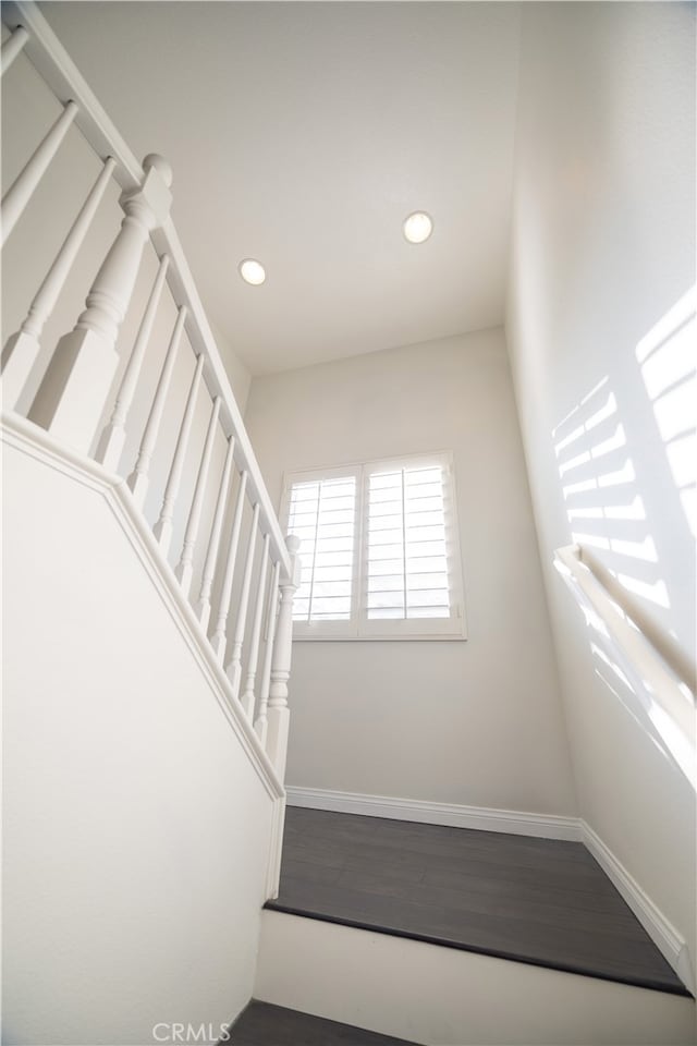 stairway featuring hardwood / wood-style flooring