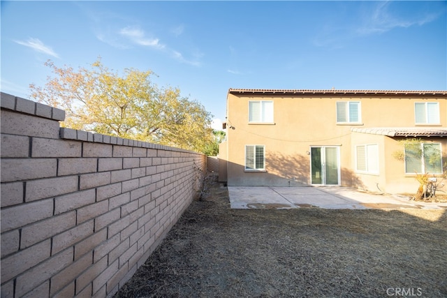 view of property exterior featuring a patio