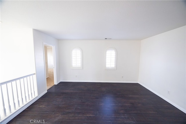 empty room with wood-type flooring