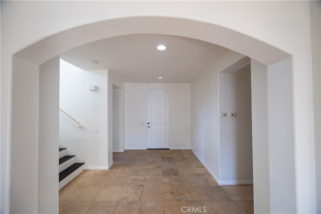 hall featuring light tile patterned floors