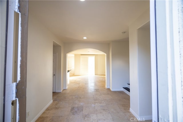 hall featuring light tile patterned floors