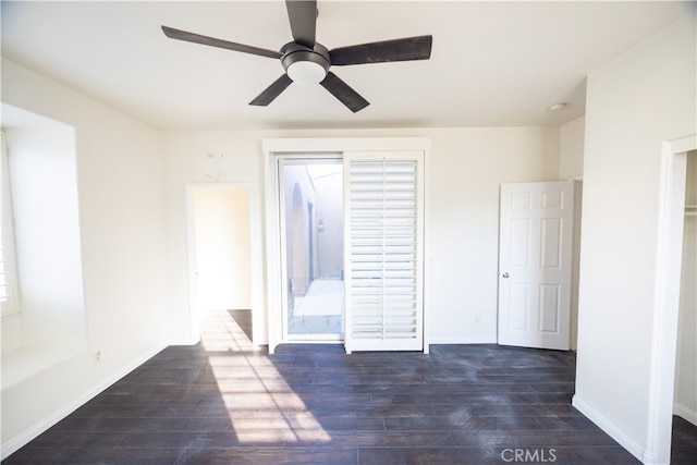 interior space featuring wood-type flooring and ceiling fan