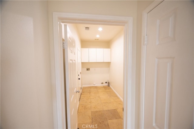 hall featuring light tile patterned floors