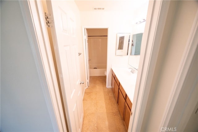 bathroom with shower / tub combination, vanity, and tile patterned floors