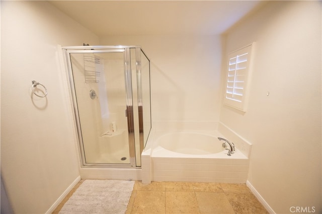 bathroom with tile patterned flooring and independent shower and bath