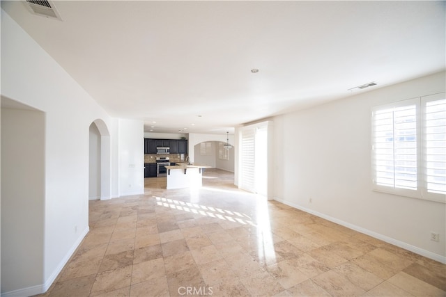 unfurnished living room with light tile patterned floors