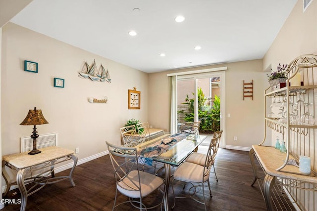 dining area with dark wood-type flooring