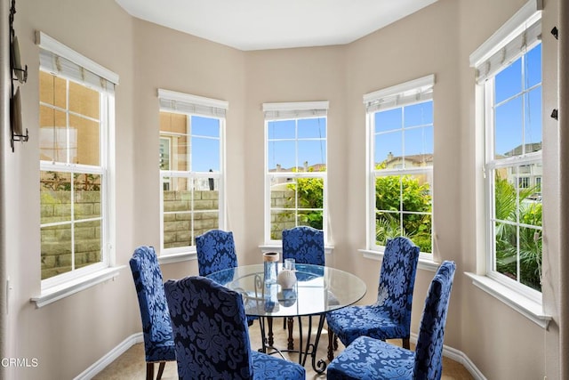 sunroom / solarium featuring a healthy amount of sunlight