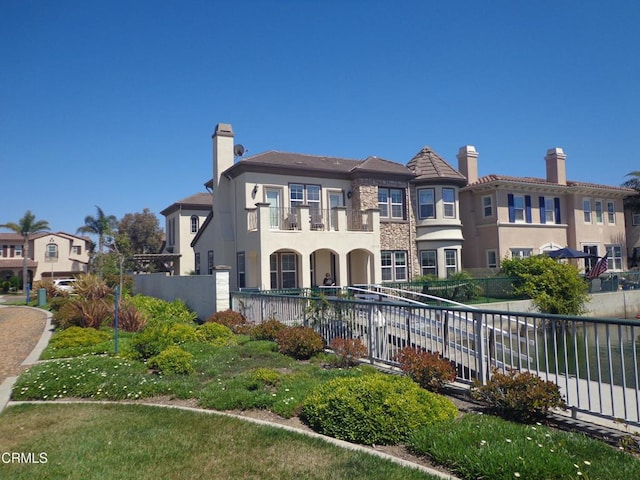 view of front of house with a balcony