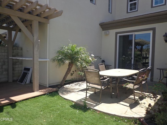 view of patio featuring a deck and a pergola