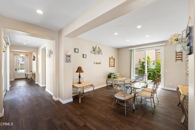 dining space with dark hardwood / wood-style floors and a healthy amount of sunlight