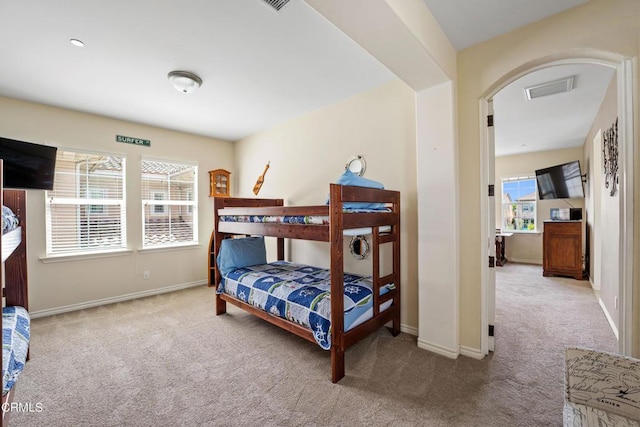 bedroom with light carpet