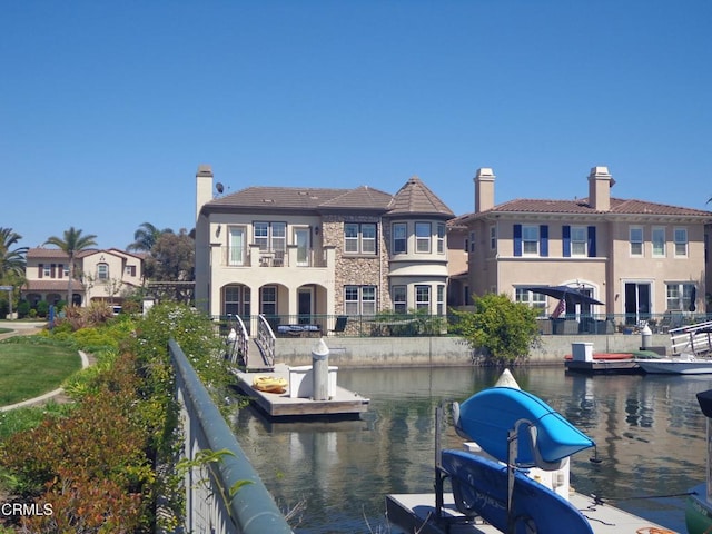 back of house featuring a water view