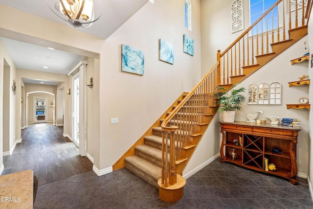 staircase with wood-type flooring