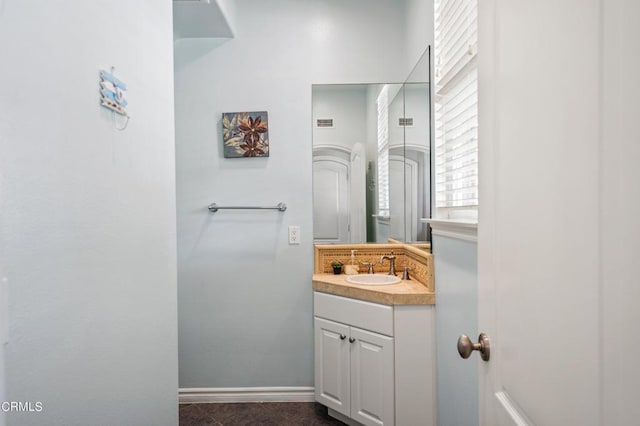 bathroom featuring tile patterned floors and vanity