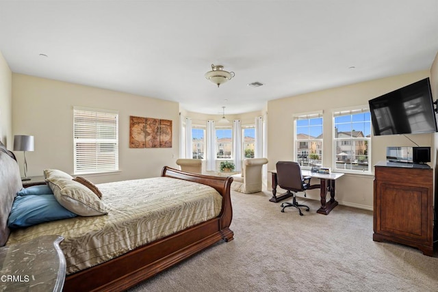 bedroom with light carpet