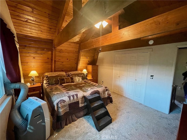 bedroom with vaulted ceiling with beams, a closet, carpet floors, wood walls, and wooden ceiling