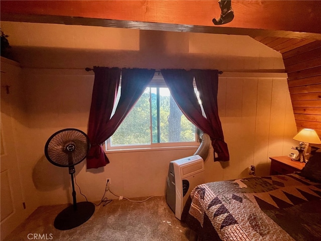 bedroom featuring carpet and lofted ceiling