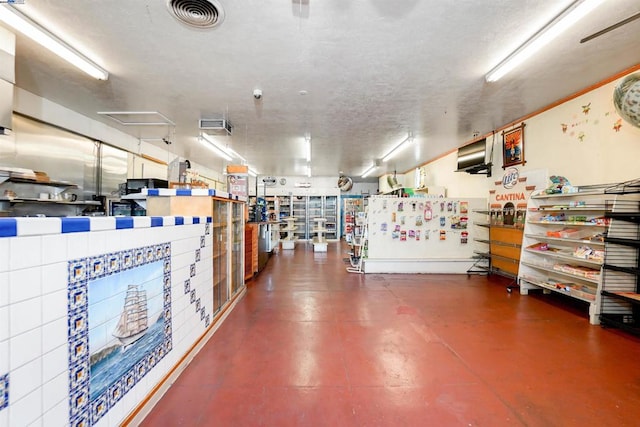 garage with white fridge