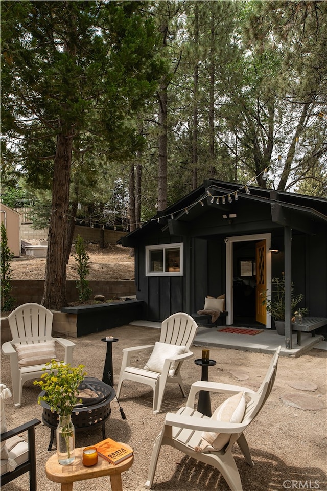 view of patio featuring an outdoor fire pit