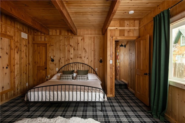 unfurnished bedroom with wood walls, beam ceiling, and wooden ceiling