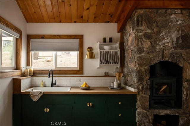 bathroom with wood ceiling, lofted ceiling, backsplash, and vanity