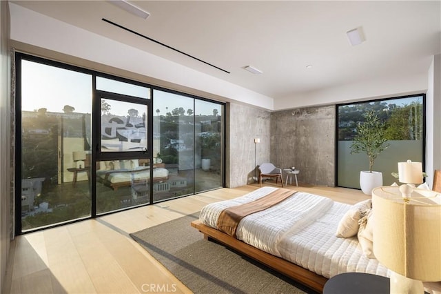 bedroom with hardwood / wood-style flooring