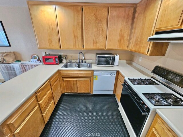 kitchen with ventilation hood, white appliances, and sink