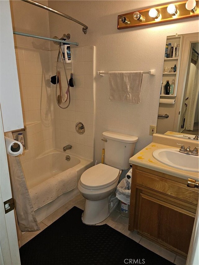 full bathroom featuring vanity, shower / tub combo, and toilet