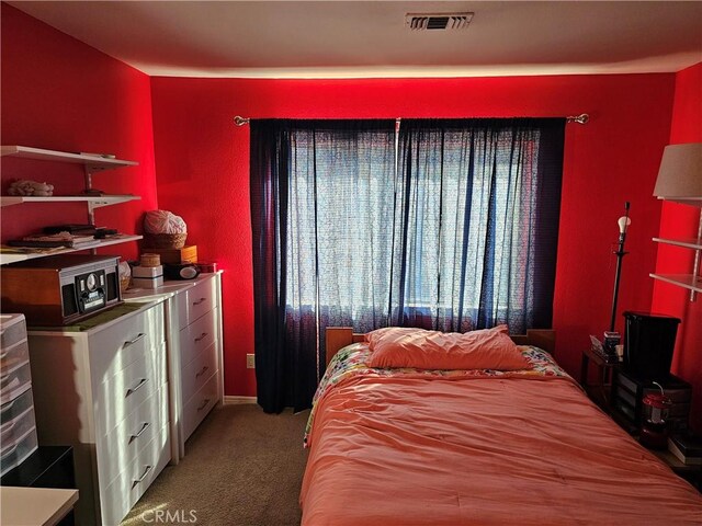 bedroom featuring carpet