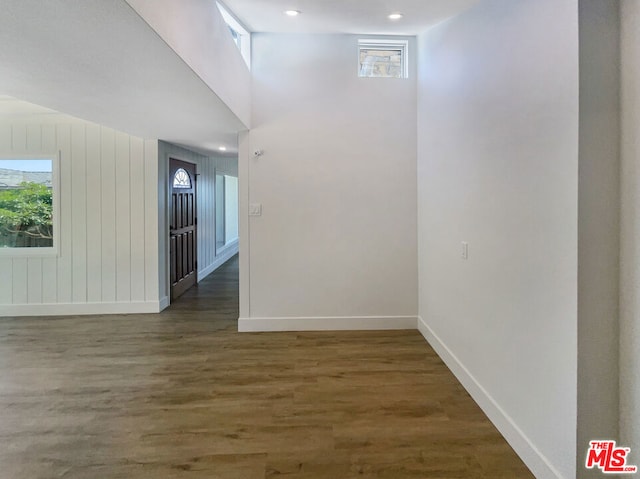 empty room featuring dark hardwood / wood-style flooring