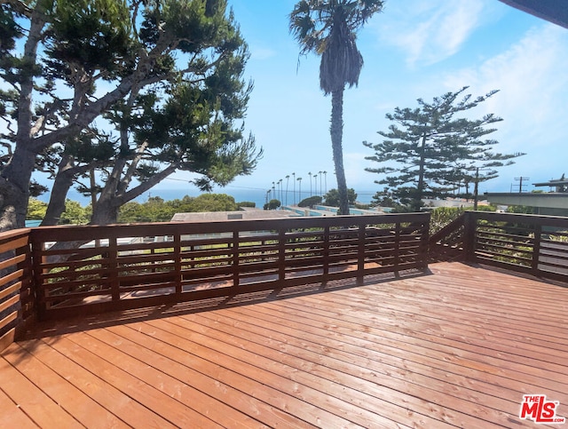 wooden deck with a water view