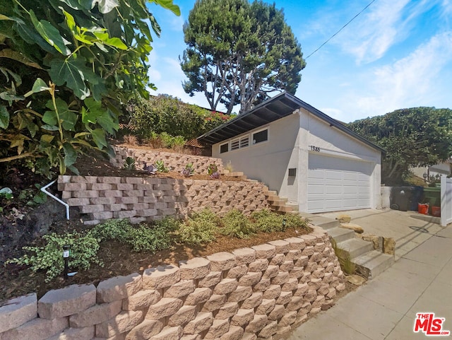 view of home's exterior with a garage