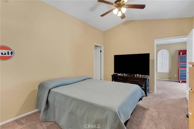 carpeted bedroom with ceiling fan and lofted ceiling