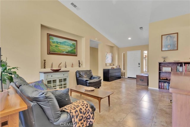 living room featuring vaulted ceiling