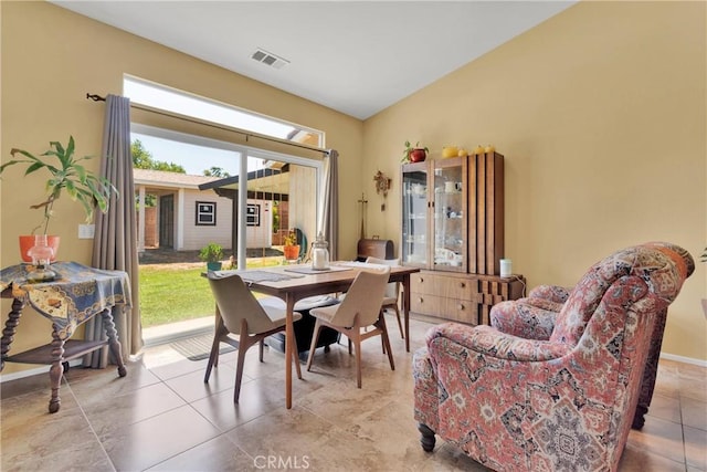 dining area featuring light tile patterned flooring