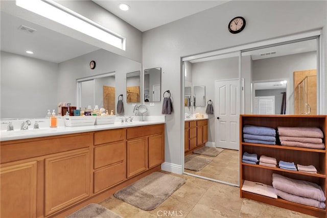 bathroom featuring vanity and walk in shower