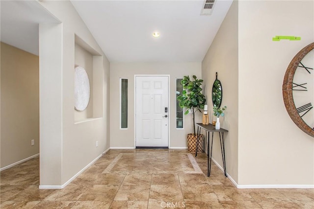 entrance foyer with baseboards and visible vents
