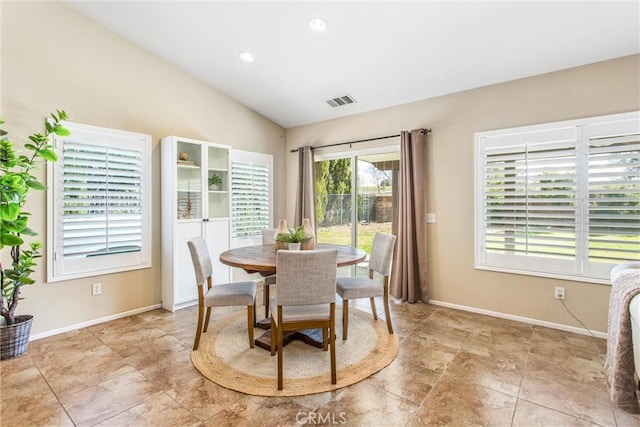 dining room featuring visible vents, recessed lighting, baseboards, and vaulted ceiling