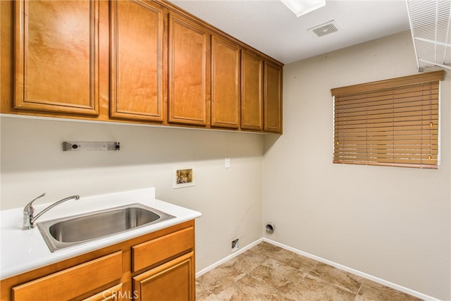 laundry area with visible vents, washer hookup, a sink, cabinet space, and hookup for an electric dryer