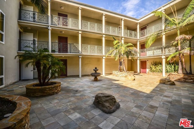 view of property's community featuring a patio area