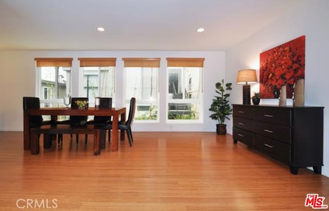 dining space with light wood-type flooring