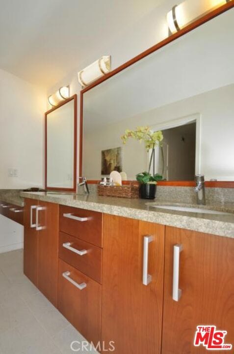 bathroom featuring vanity and tile patterned flooring