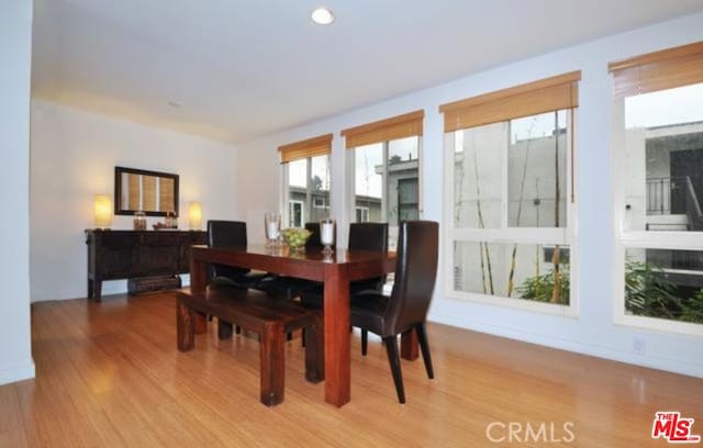 dining space featuring wood-type flooring