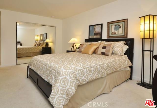 carpeted bedroom featuring a closet