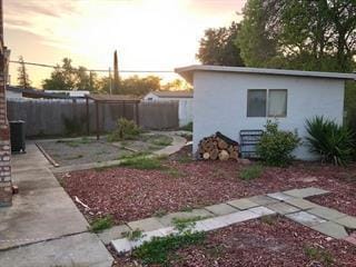 yard at dusk with a patio