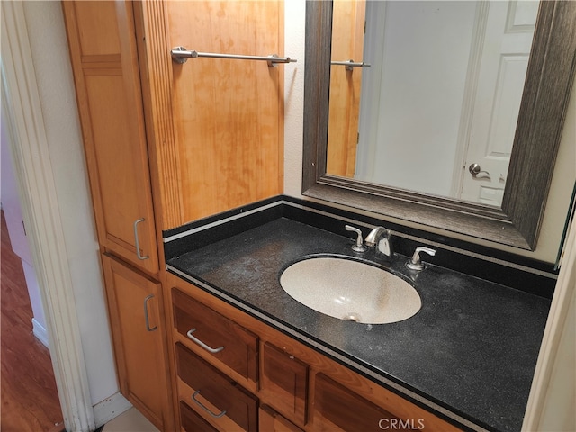 bathroom with vanity and hardwood / wood-style floors