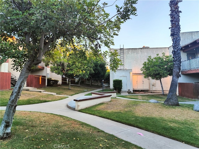 view of home's community with a lawn