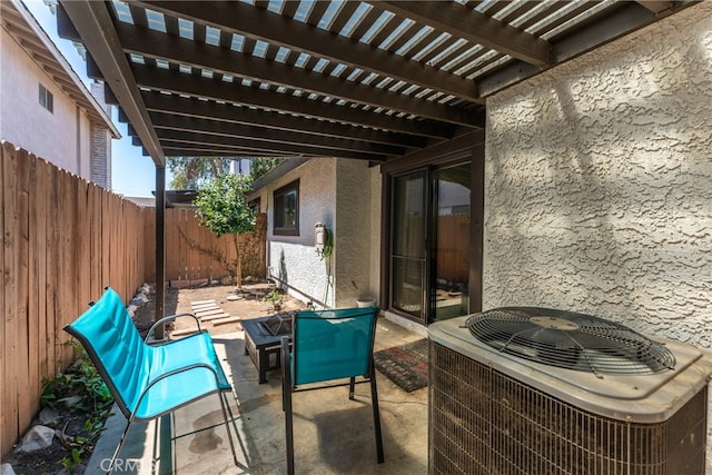 view of patio / terrace with central AC and a pergola