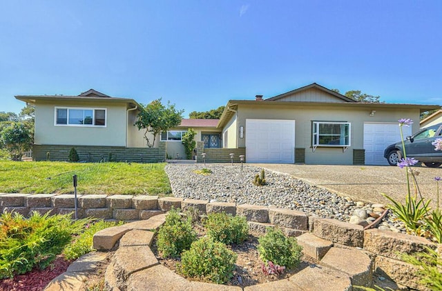 single story home featuring a garage